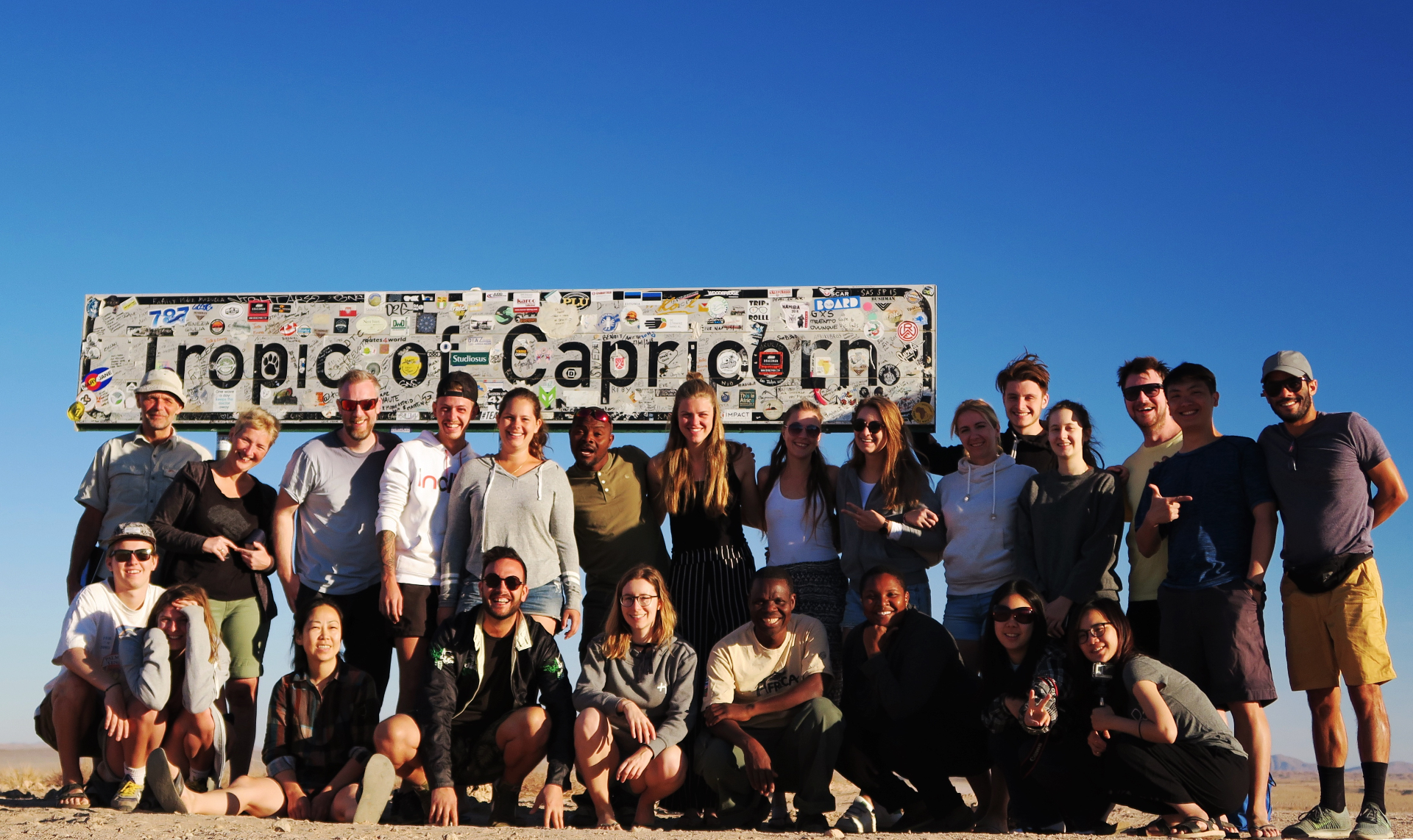 SJU Luxe Travel group tour at the Tropic of Capricorn marker